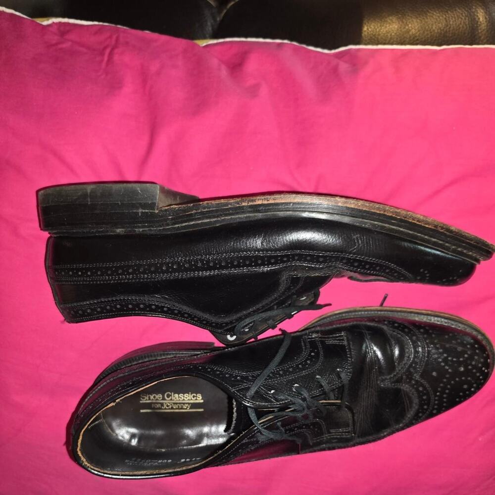 Black leather wingtip dress shoes